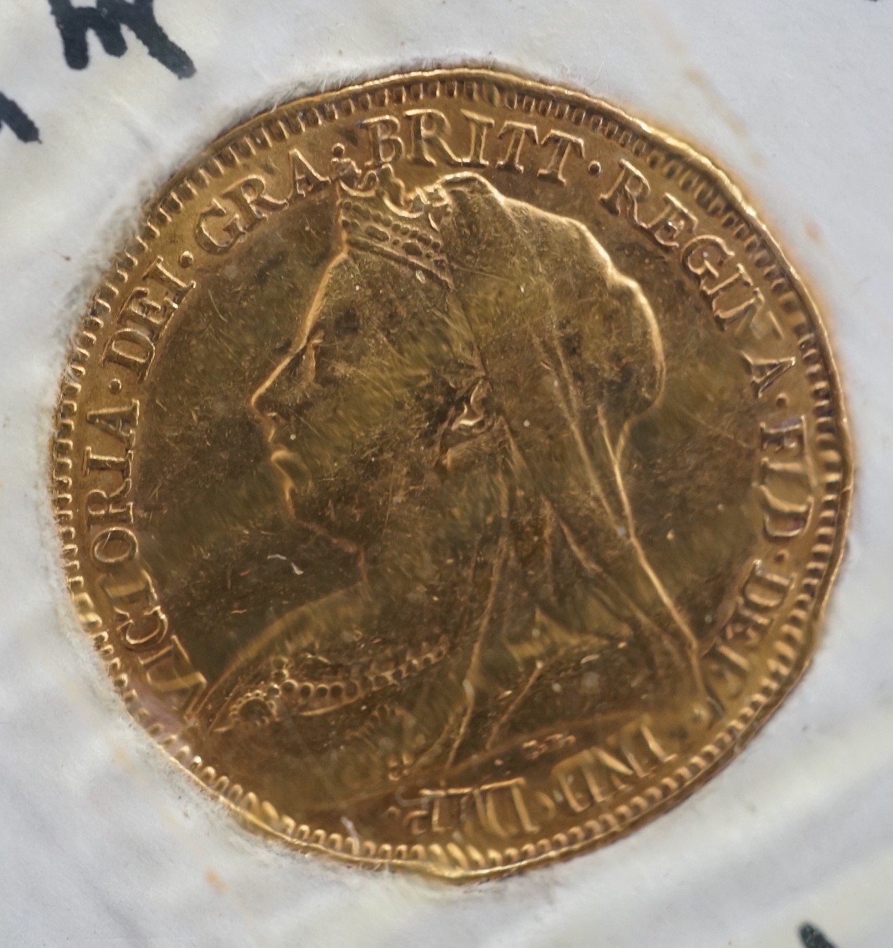 A Victorian 1897 gold half sovereign.